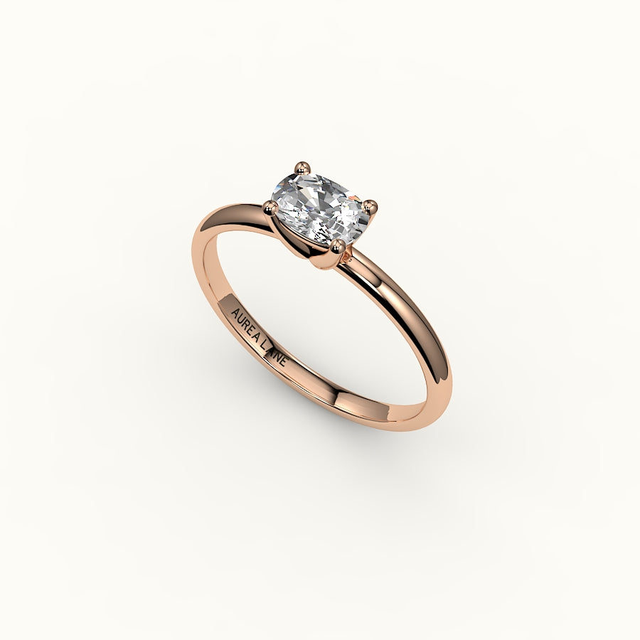 Anillo solitario con engaste de cojín alargado este-oeste