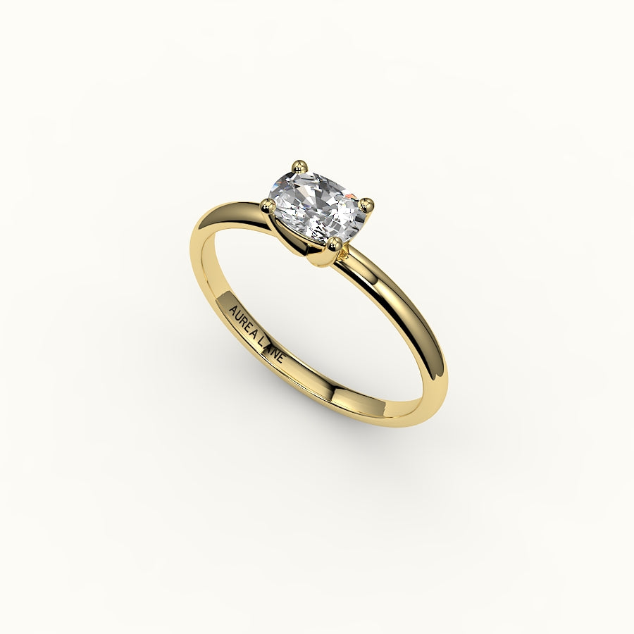 Anillo solitario con engaste de cojín alargado este-oeste