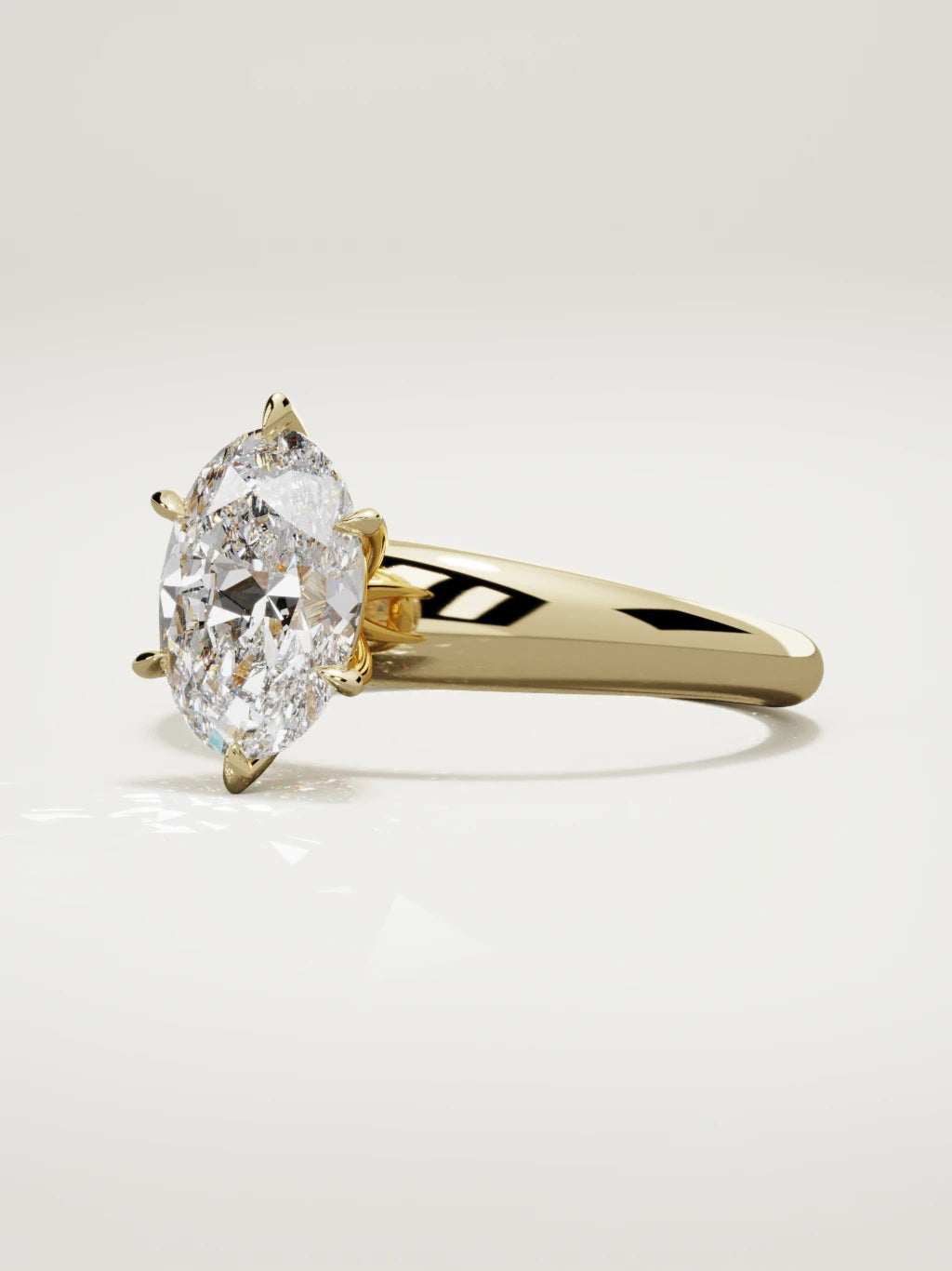 The Aire oval lab-grown diamond solitaire in 14K yellow gold, three-quarter view