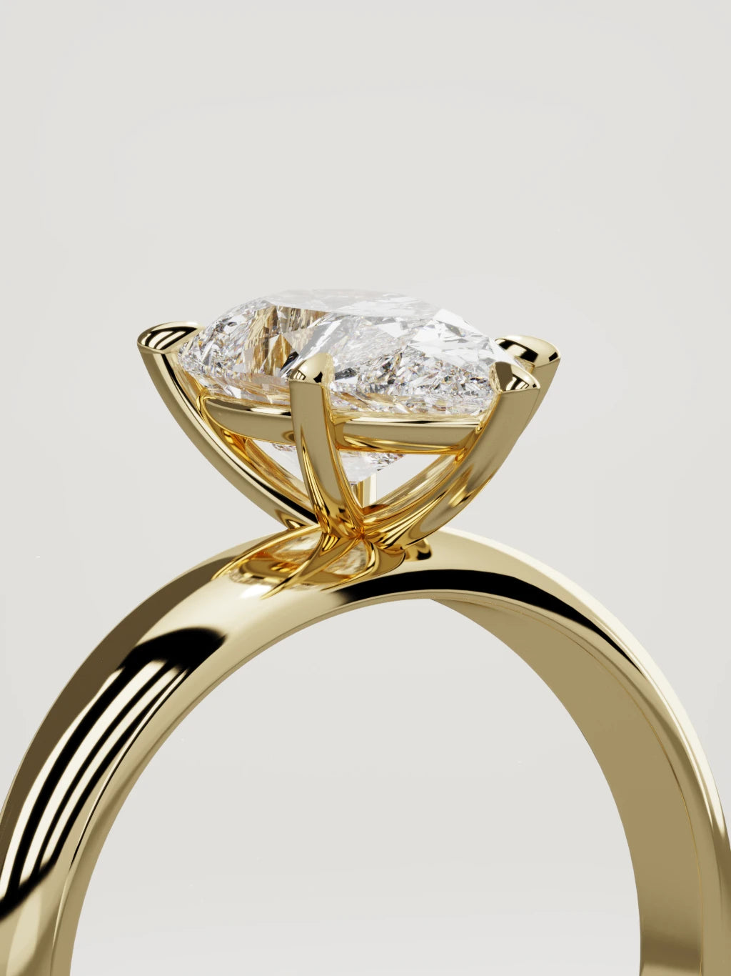 The Aire pear-shaped lab-grown diamond solitaire in 14K yellow gold, standing three-quarter view