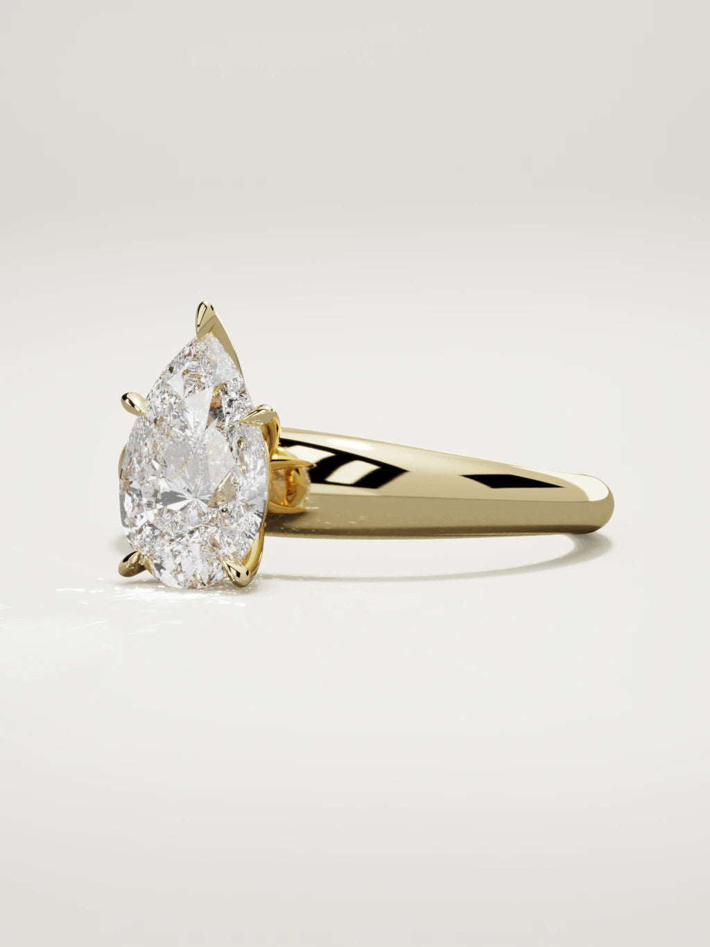The Aire pear-shaped lab-grown diamond solitaire in 14K yellow gold, three-quarter view