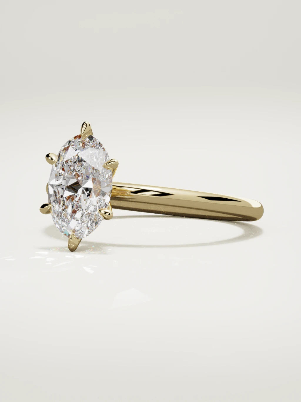 The Alba oval lab-grown diamond solitaire in 14K yellow gold, three-quarter view