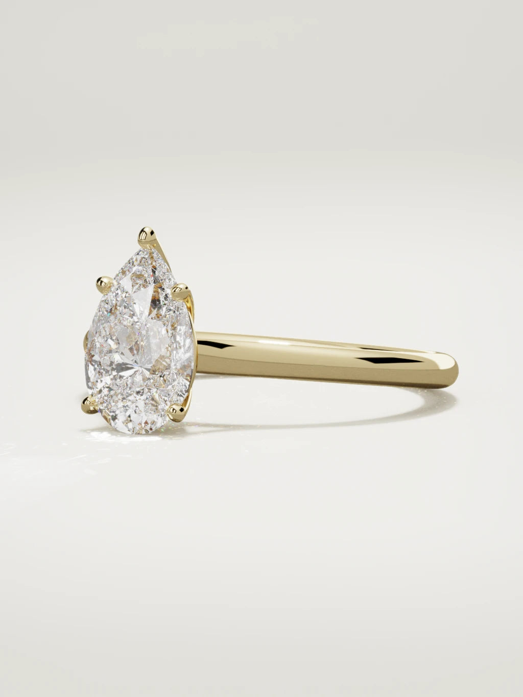 The Altar pear-shaped lab-grown diamond solitaire in 14K yellow gold, three-quarter view