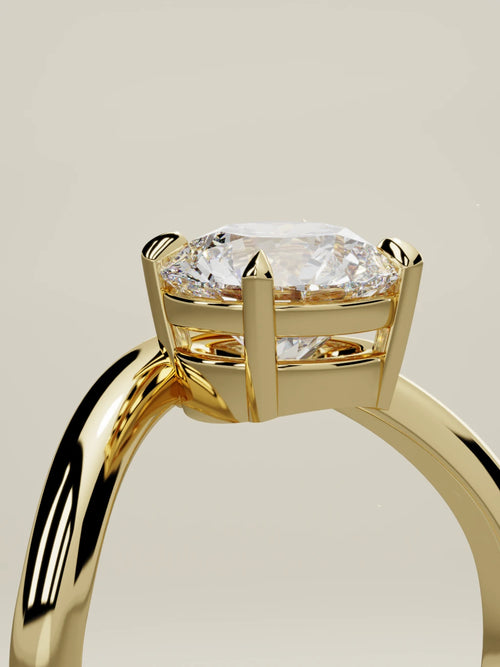 The Arco round lab-grown diamond solitaire in 14K yellow gold, standing three-quarter view