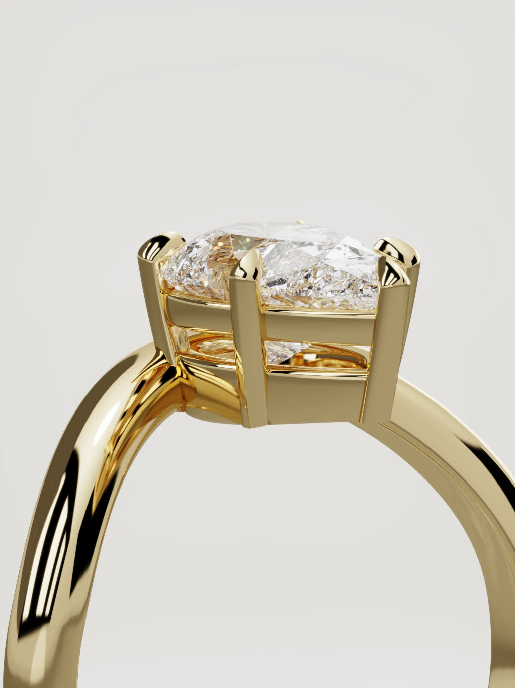 The Arco pear-shaped lab-grown diamond solitaire in 14K yellow gold, standing three-quarter view