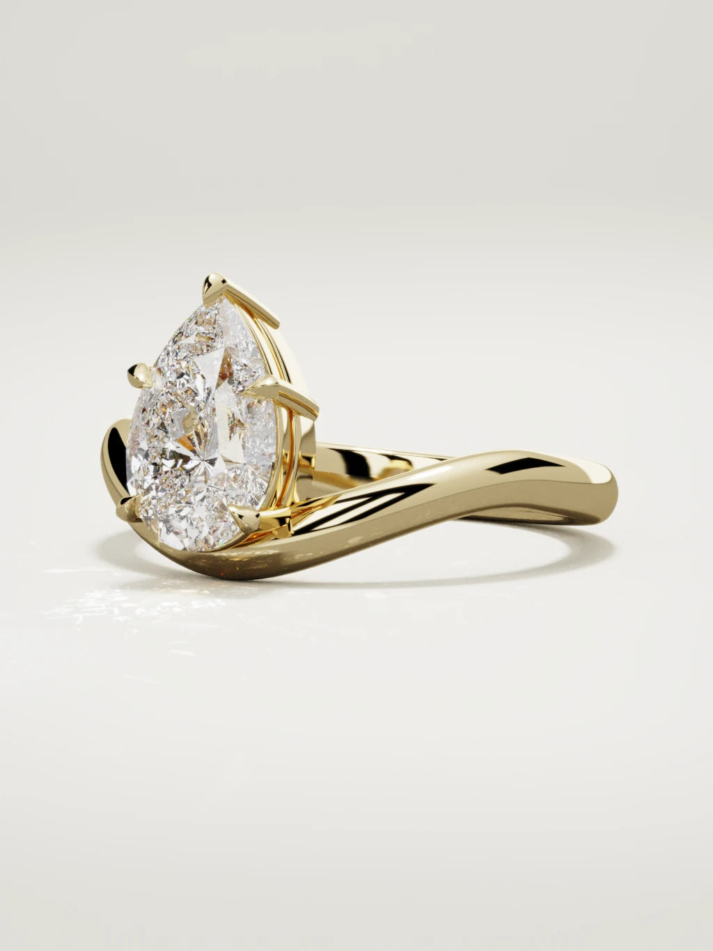 The Arco pear-shaped lab-grown diamond solitaire in 14K yellow gold, three-quarter view