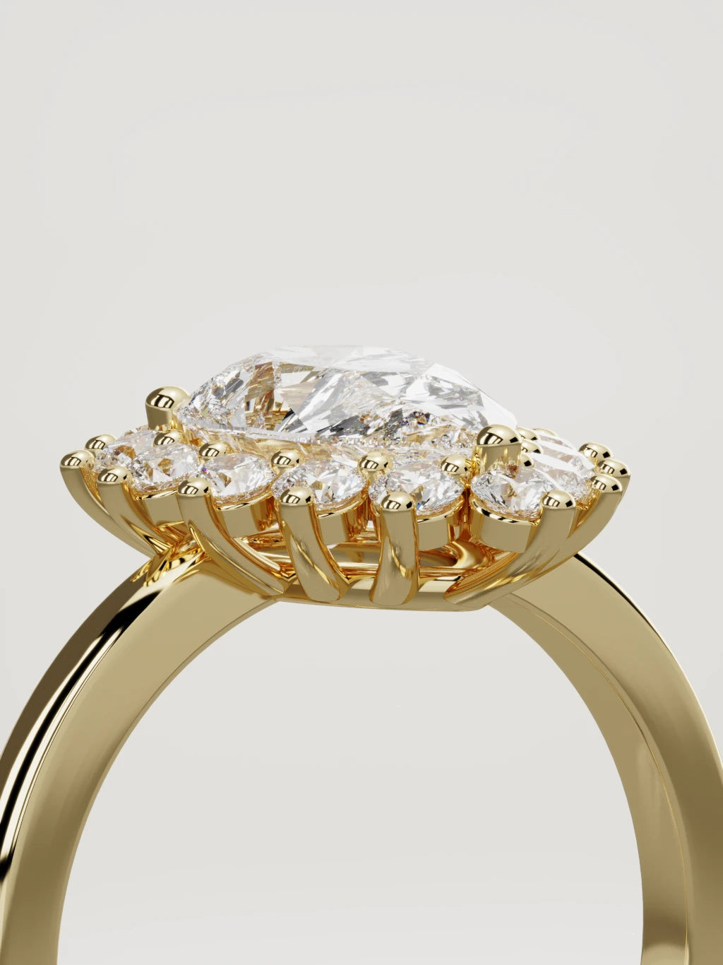 The Aura pear-shaped lab-grown diamond solitaire in 14K yellow gold, standing three-quarter view