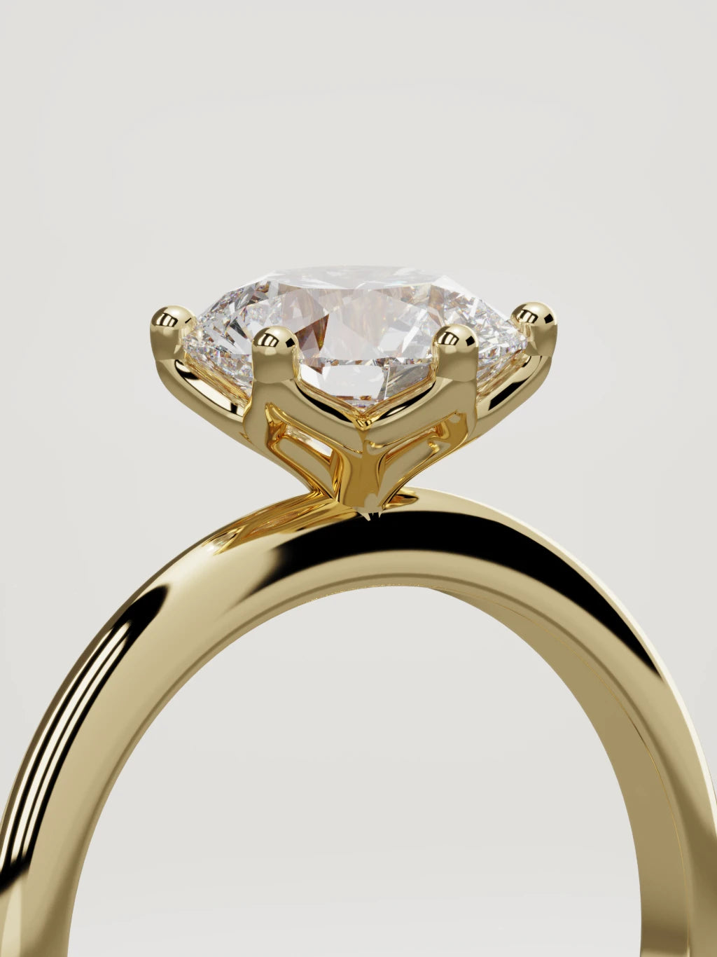 The Dalia round lab-grown diamond solitaire in 14K yellow gold, standing three-quarter view