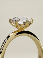 The Dalia round lab-grown diamond solitaire in 14K yellow gold, standing three-quarter view