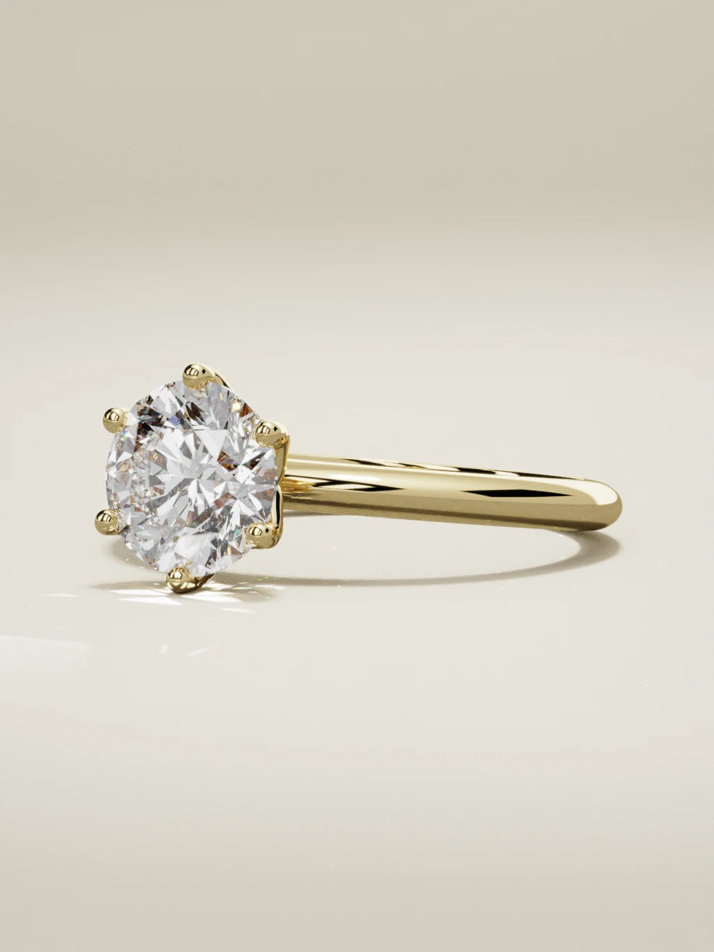 The Dalia round lab-grown diamond solitaire in 14K yellow gold, three-quarter view