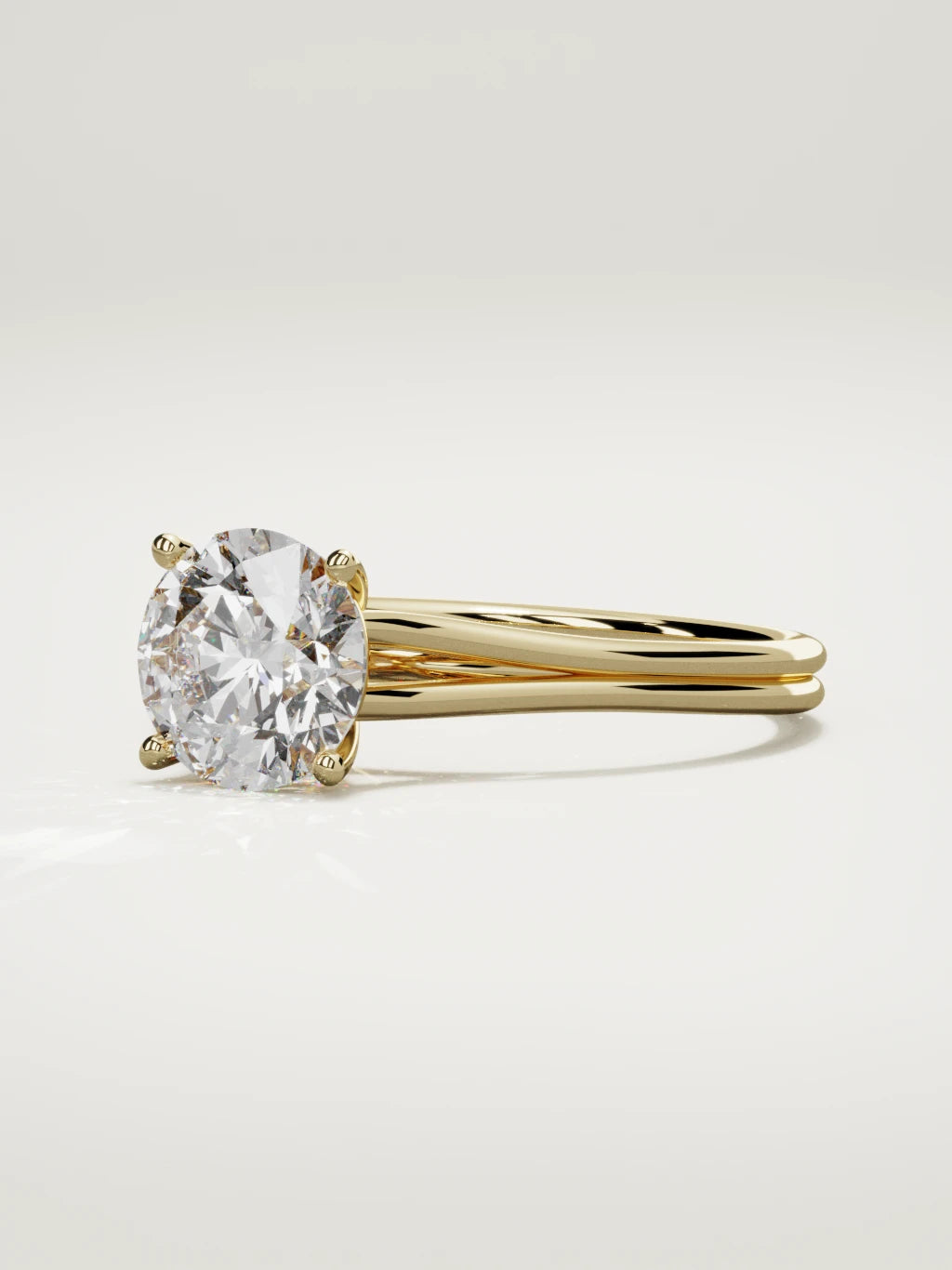 The Duo round lab-grown diamond solitaire in 14K yellow gold, three-quarter view