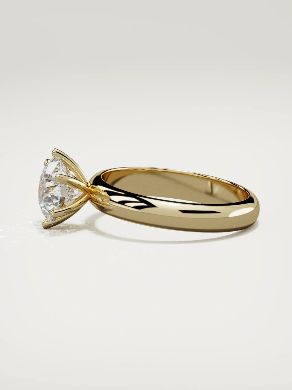 The Fina round lab-grown diamond solitaire in 14K yellow gold, side view