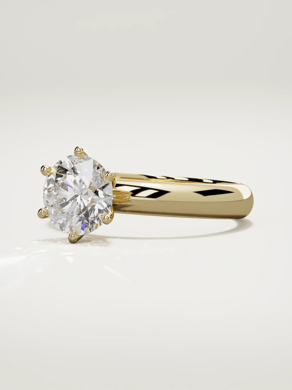 The Fina round lab-grown diamond solitaire in 14K yellow gold, three-quarter view