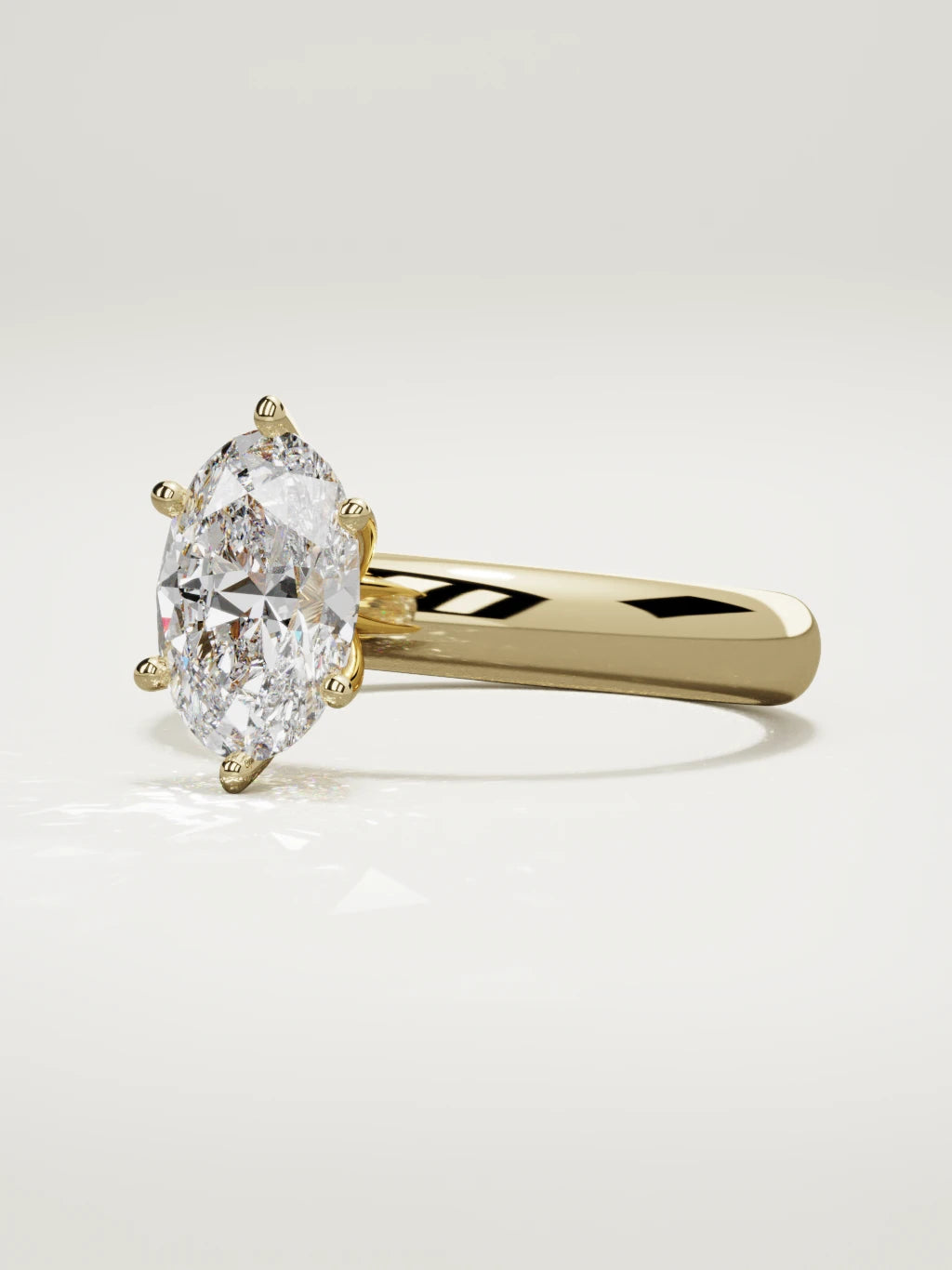 The Fina oval lab-grown diamond solitaire in 14K yellow gold, three-quarter view