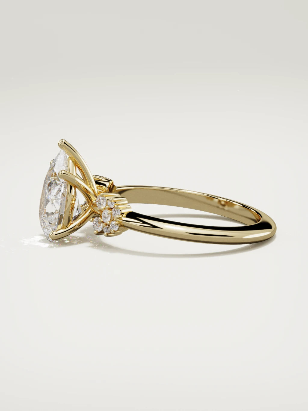 The Flora pear-shaped lab-grown diamond solitaire in 14K yellow gold, side view