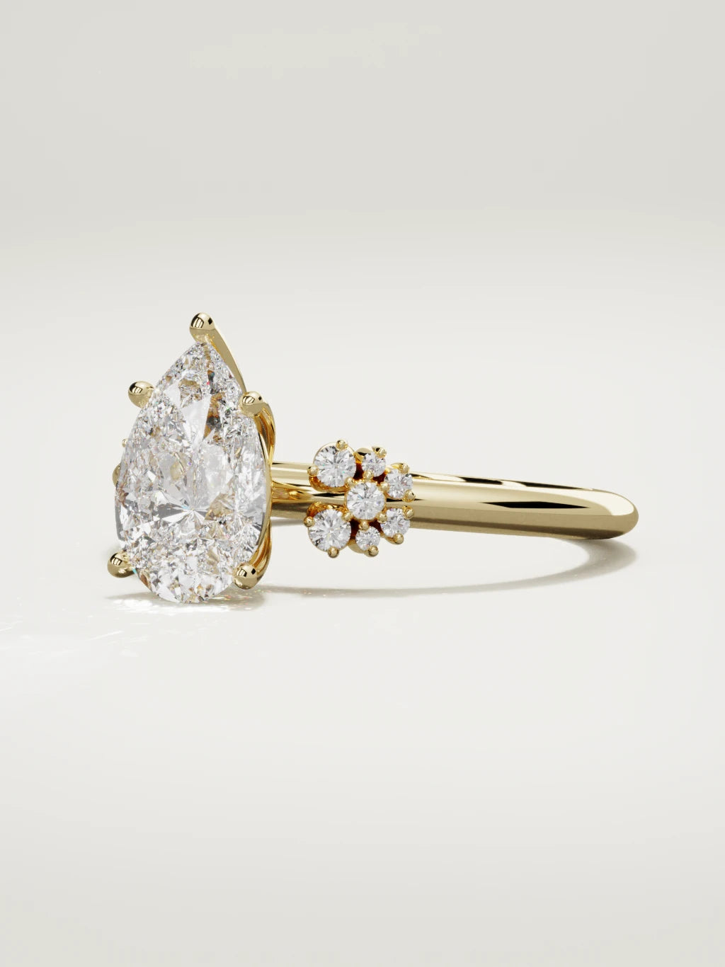 The Flora pear-shaped lab-grown diamond solitaire in 14K yellow gold, three-quarter view