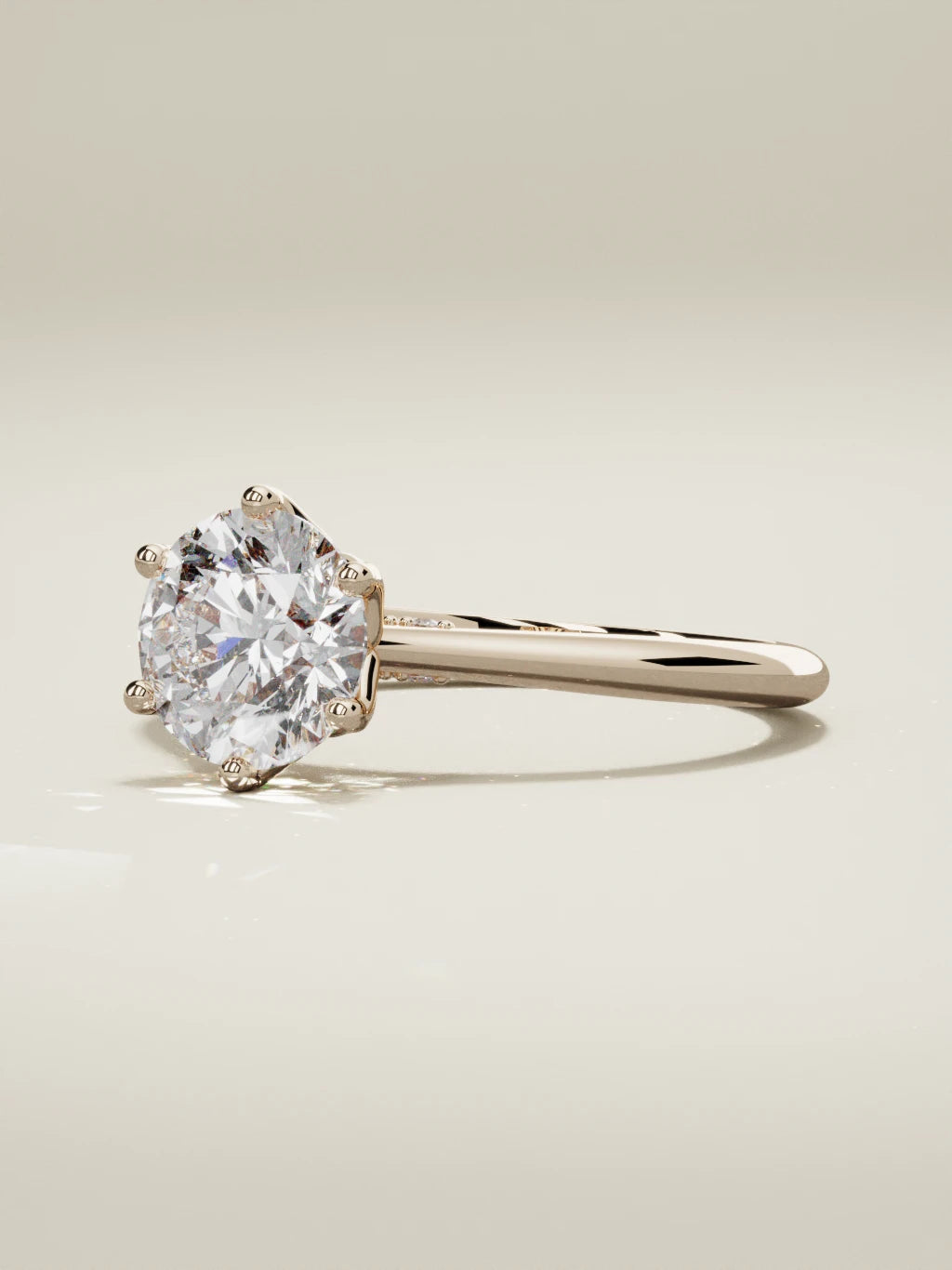 The Iris, solitario con diamante redondo de laboratorio en oro rosa 14K, vista de tres cuartos
