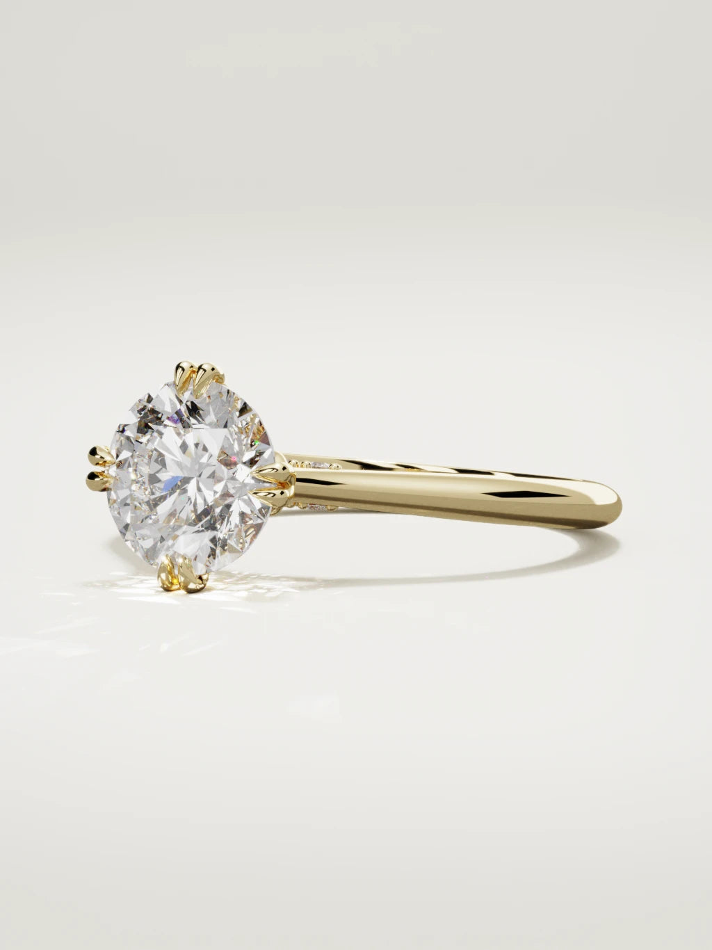 The Jazmin round lab-grown diamond solitaire in 14K yellow gold, three-quarter view