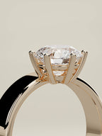 The Joya round lab-grown diamond solitaire in 14K rose gold, standing three-quarter view