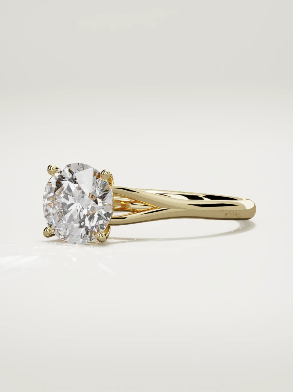 The Lazo round lab-grown diamond solitaire in 14K yellow gold, three-quarter view