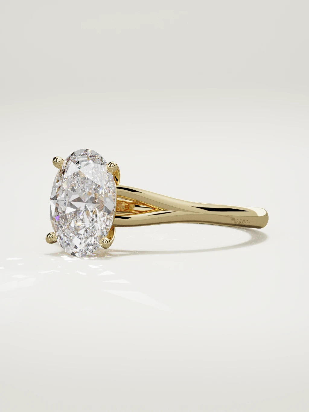 The Lazo oval lab-grown diamond solitaire in 14K yellow gold, three-quarter view