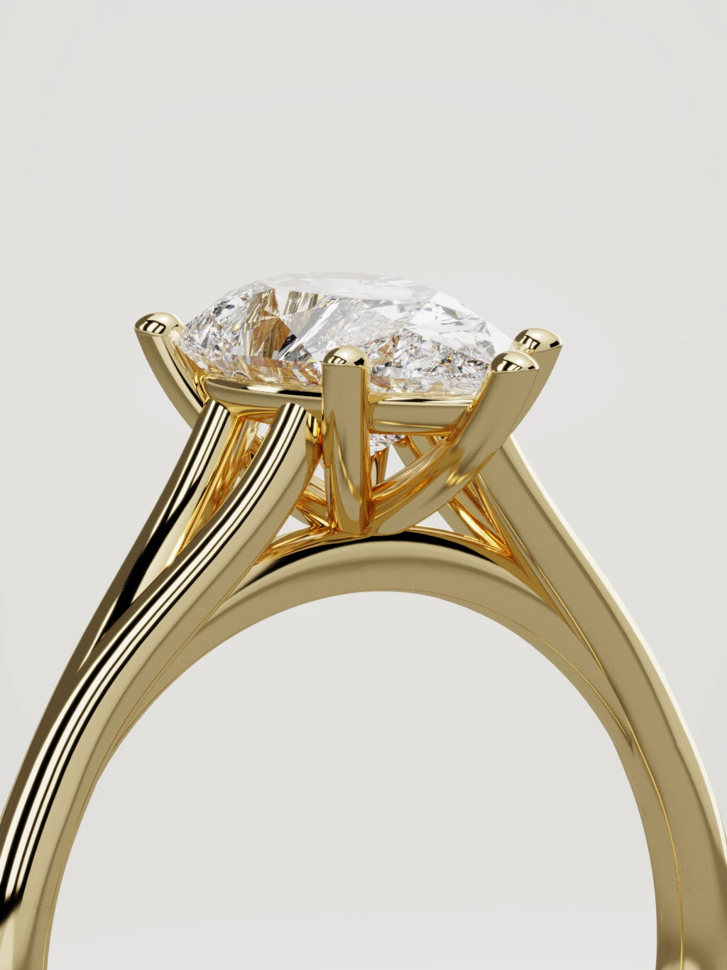The Lazo pear-shaped lab-grown diamond solitaire in 14K yellow gold, standing three-quarter view
