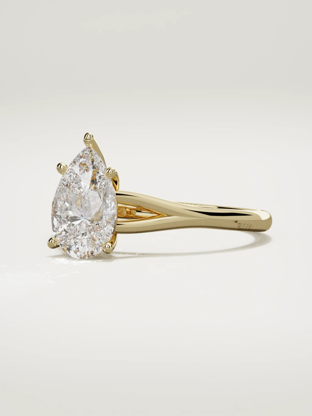 The Lazo pear-shaped lab-grown diamond solitaire in 14K yellow gold, three-quarter view