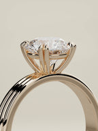 The Lira round lab-grown diamond solitaire in 14K rose gold, standing three-quarter view