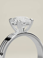 The Lira round lab-grown diamond solitaire in 14K white gold, standing three-quarter view