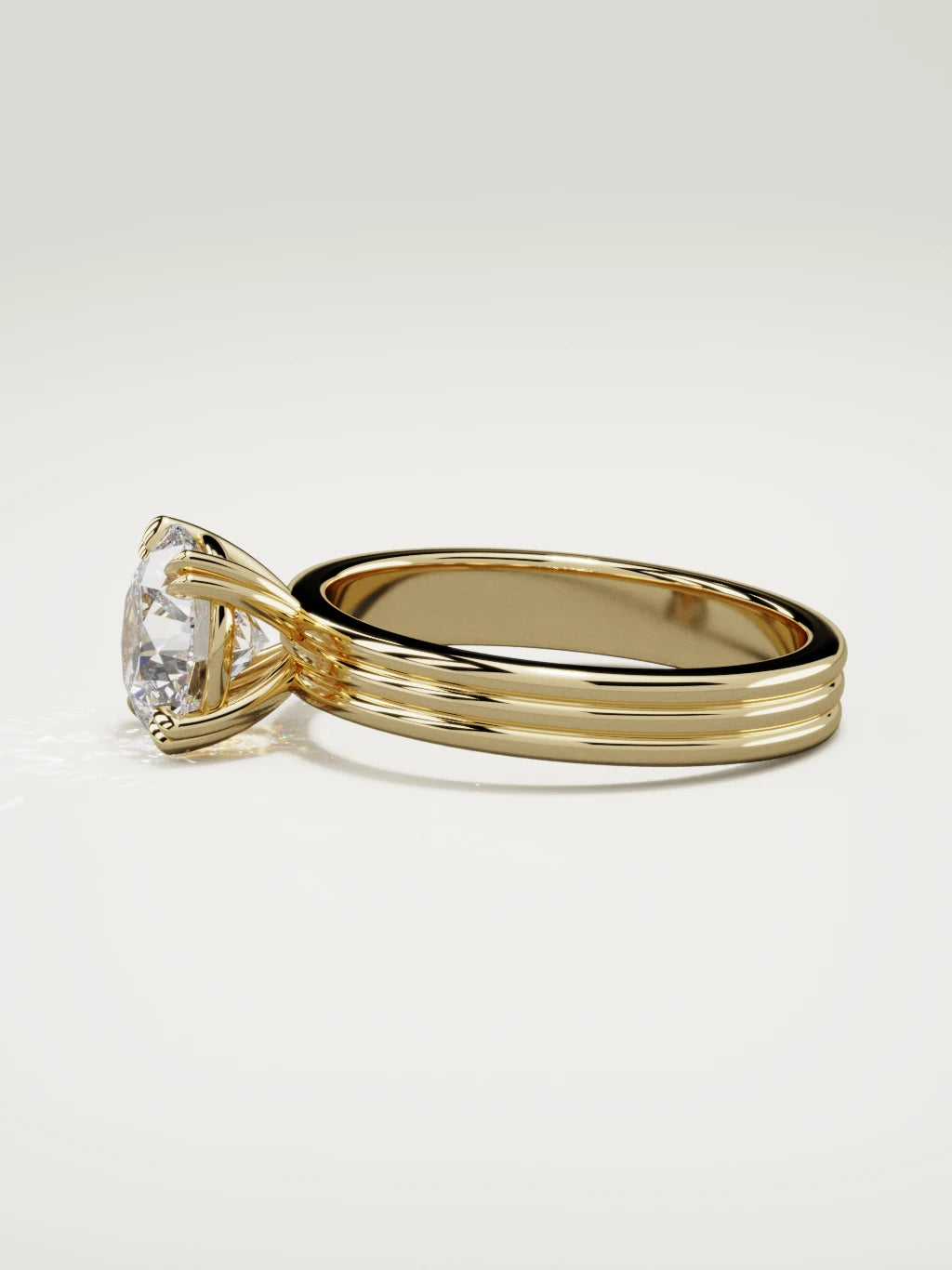 The Lira round lab-grown diamond solitaire in 14K yellow gold, side view