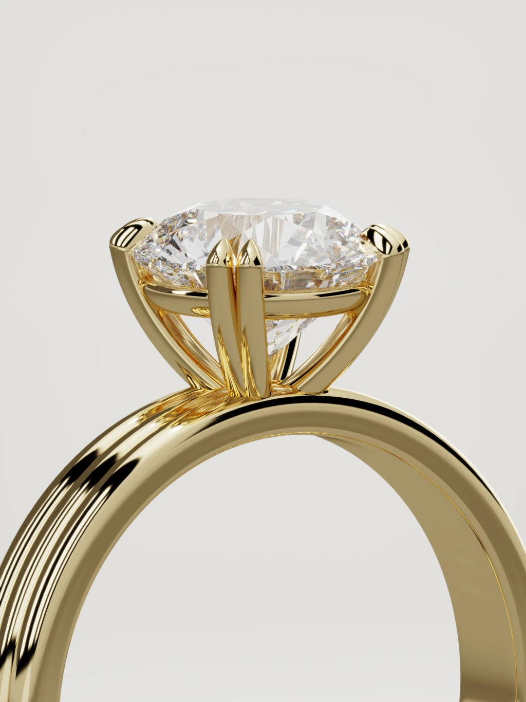 The Lira round lab-grown diamond solitaire in 14K yellow gold, standing three-quarter view