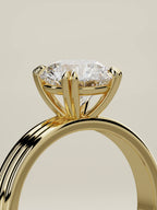 The Lira round lab-grown diamond solitaire in 14K yellow gold, standing three-quarter view