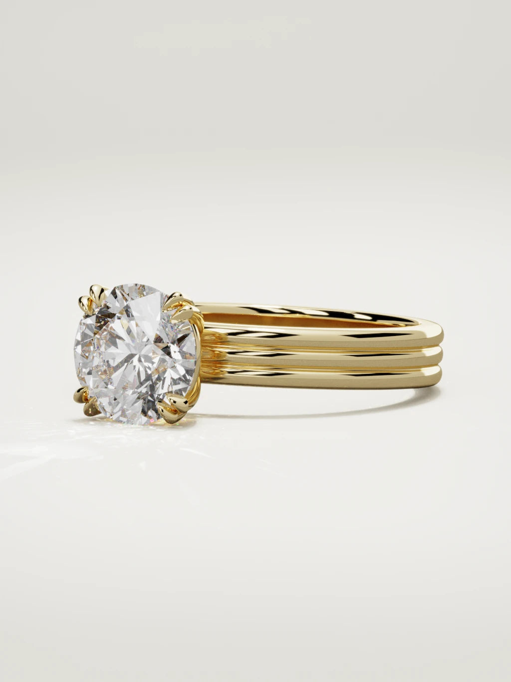 The Lira round lab-grown diamond solitaire in 14K yellow gold, three-quarter view