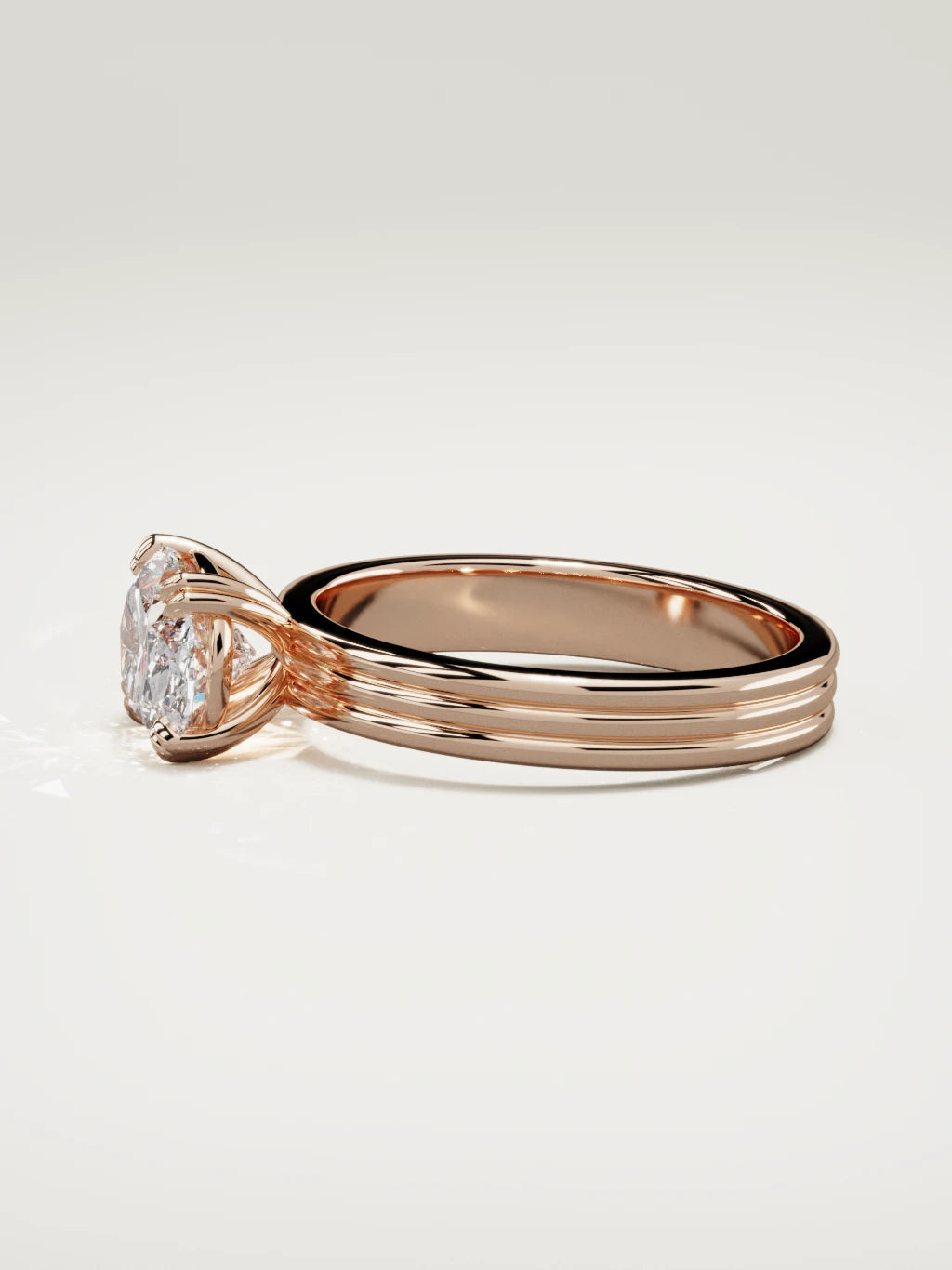 The Lira east-west oval lab-grown diamond solitaire in 14K rose gold, side view