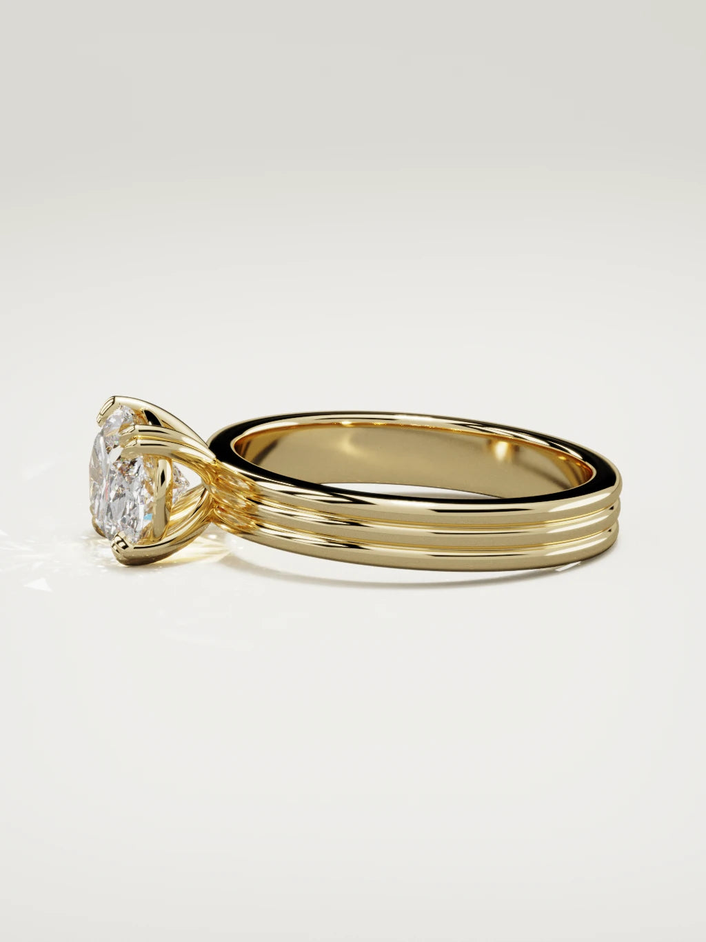 The Lira east-west oval lab-grown diamond solitaire in 14K yellow gold, side view