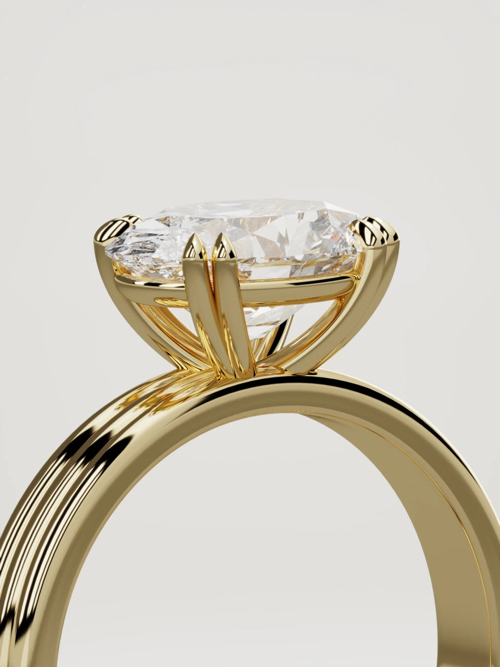 The Lira east-west oval lab-grown diamond solitaire in 14K yellow gold, standing three-quarter view