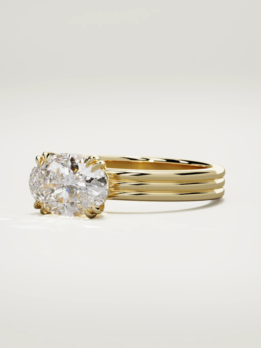The Lira east-west oval lab-grown diamond solitaire in 14K yellow gold, three-quarter view