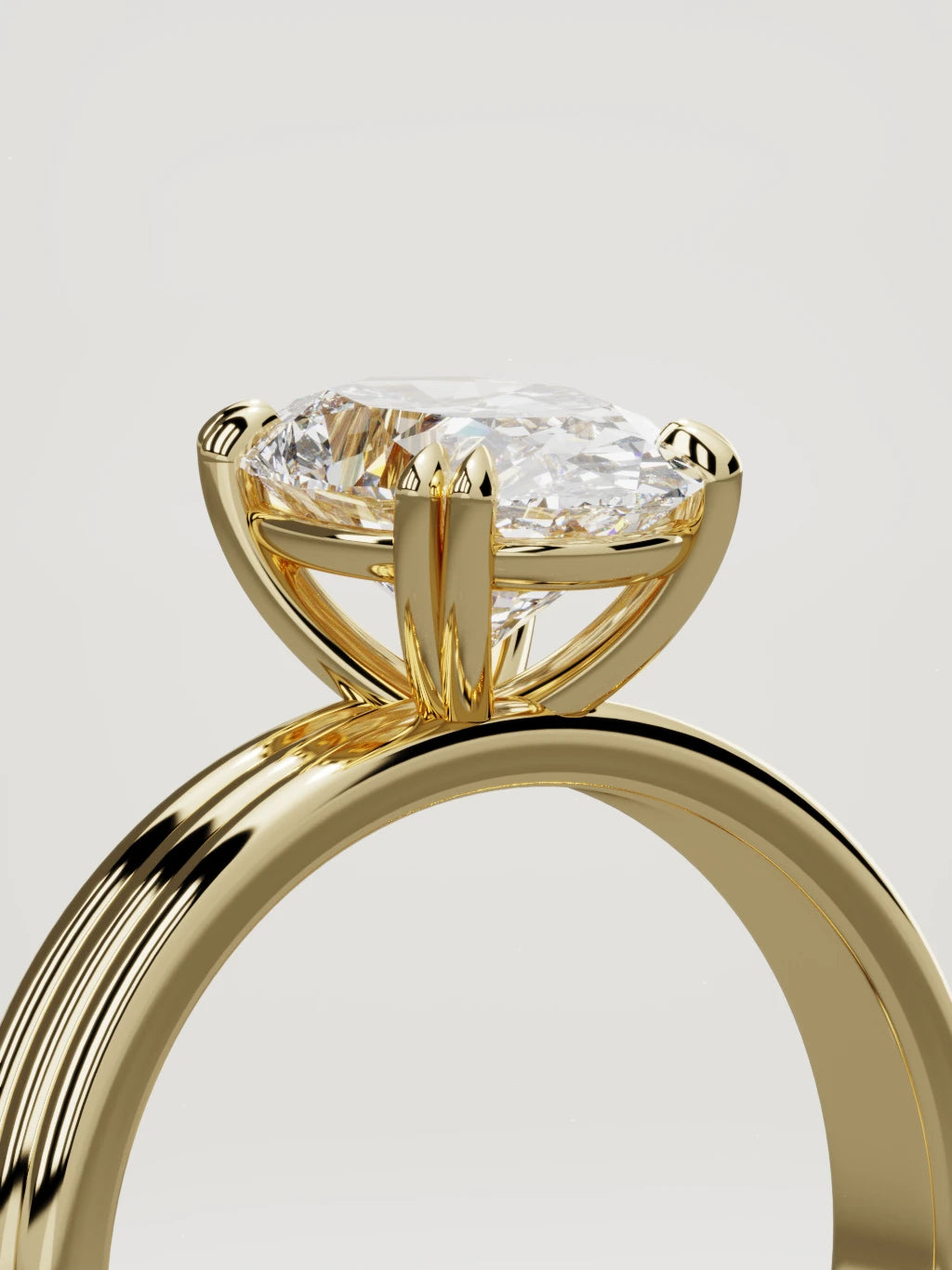 The Lira oval lab-grown diamond solitaire in 14K yellow gold, standing three-quarter view