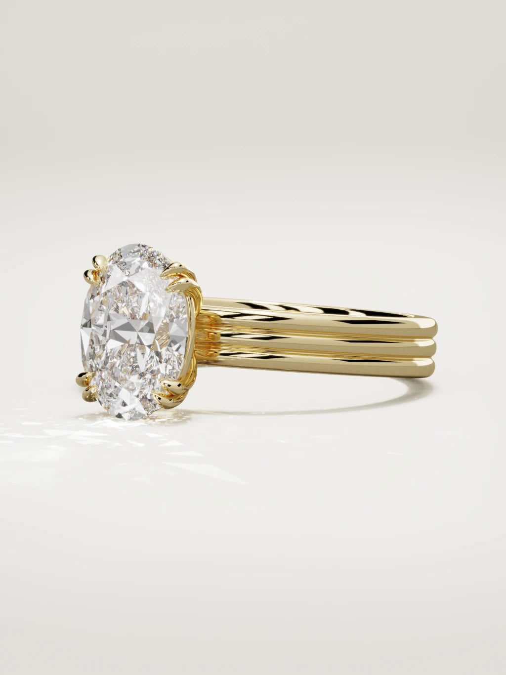 The Lira oval lab-grown diamond solitaire in 14K yellow gold, three-quarter view