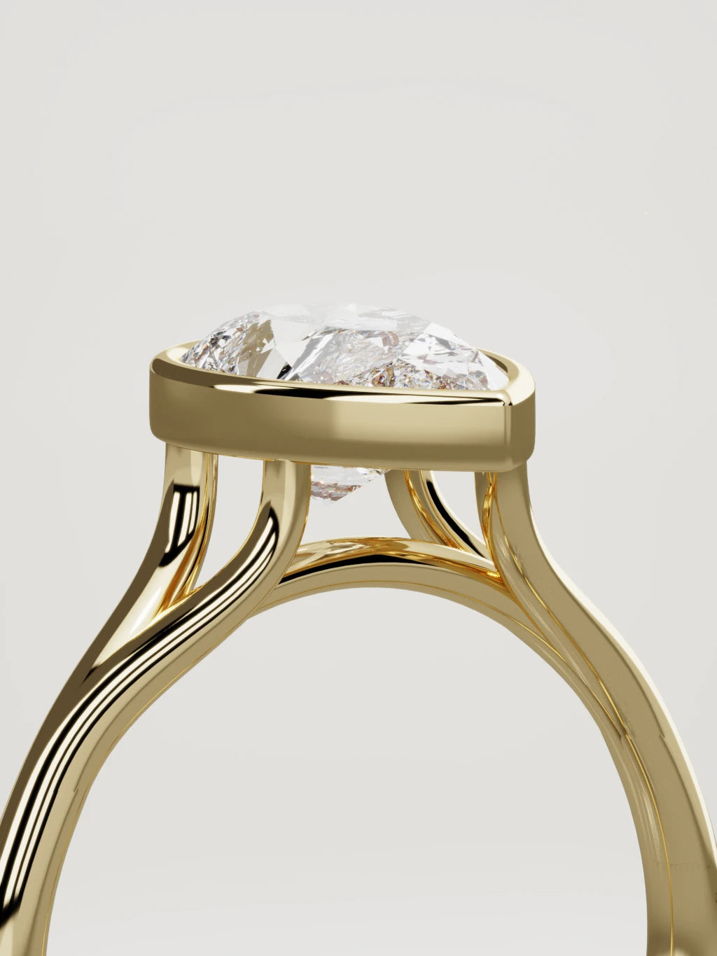 The Luna pear-shaped lab-grown diamond solitaire in 14K yellow gold, standing three-quarter view
