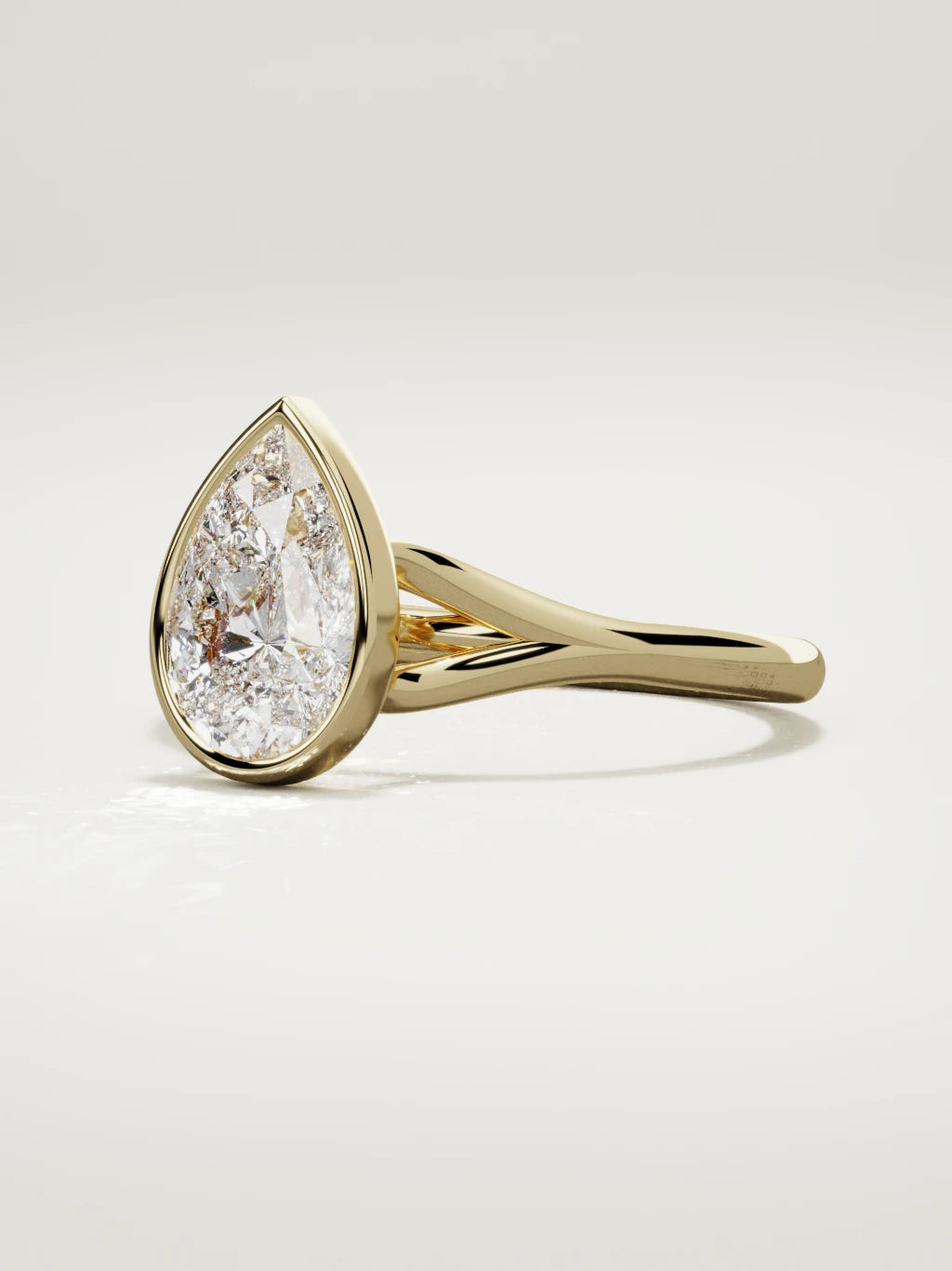 The Luna pear-shaped lab-grown diamond solitaire in 14K yellow gold, three-quarter view