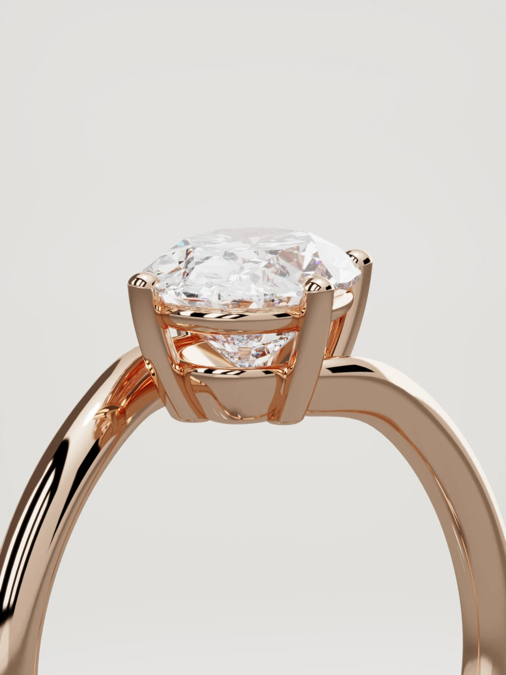 The Ola east-west oval lab-grown diamond solitaire in 14K rose gold, standing three-quarter view