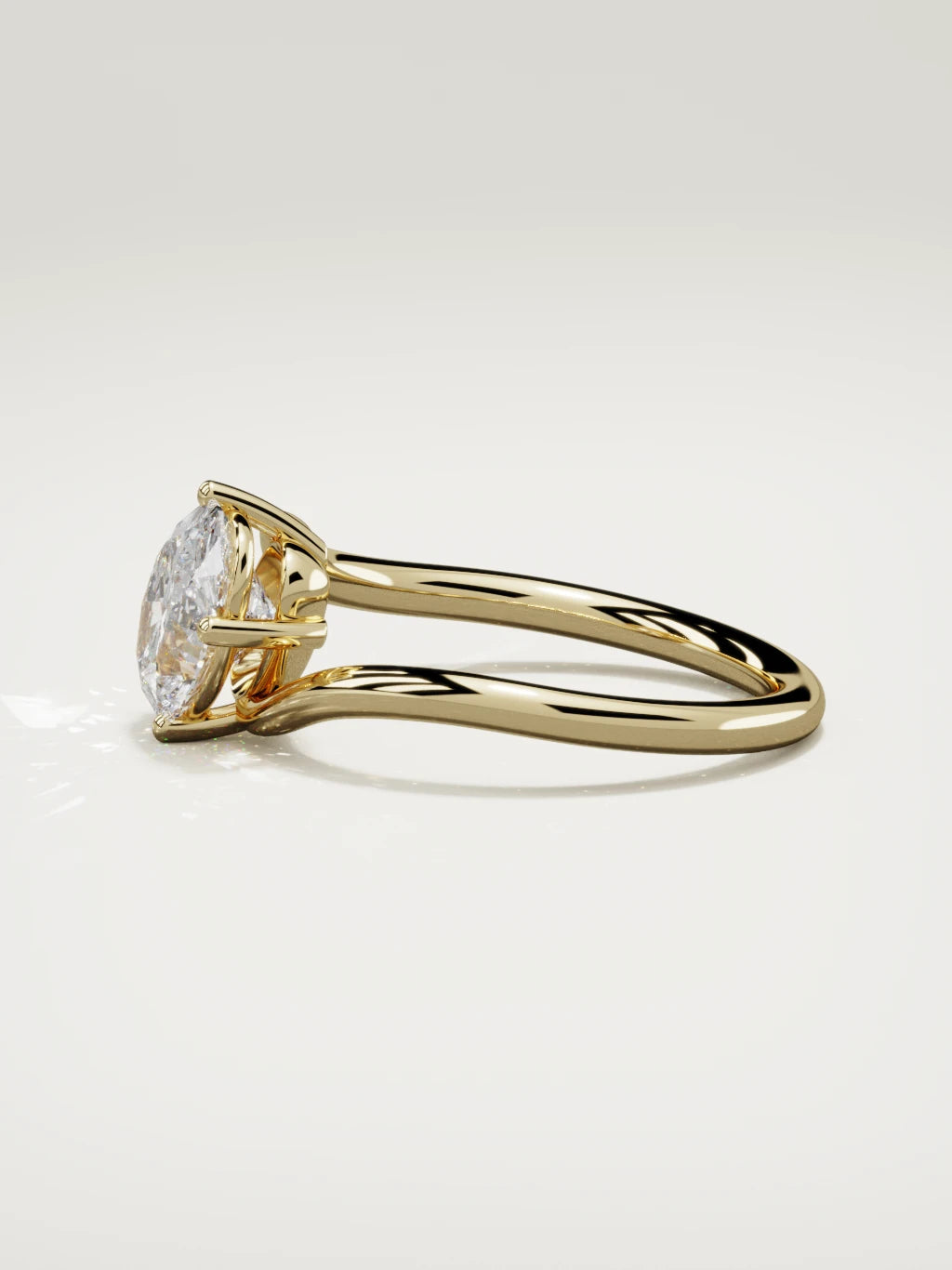 The Ola east-west oval lab-grown diamond solitaire in 14K yellow gold, side view