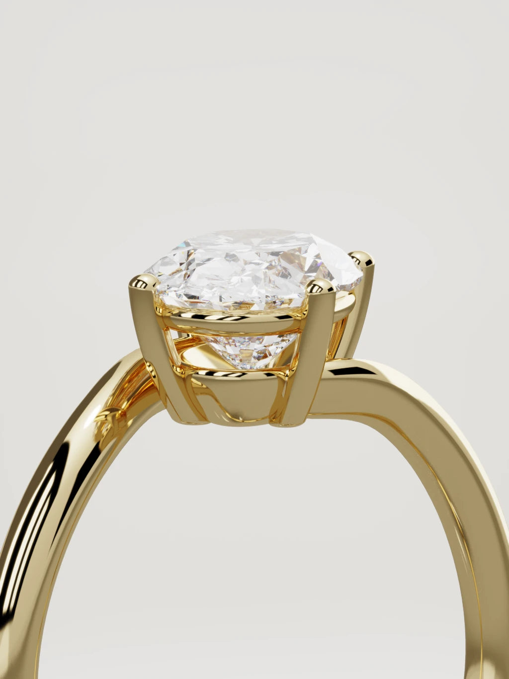 The Ola east-west oval lab-grown diamond solitaire in 14K yellow gold, standing three-quarter view