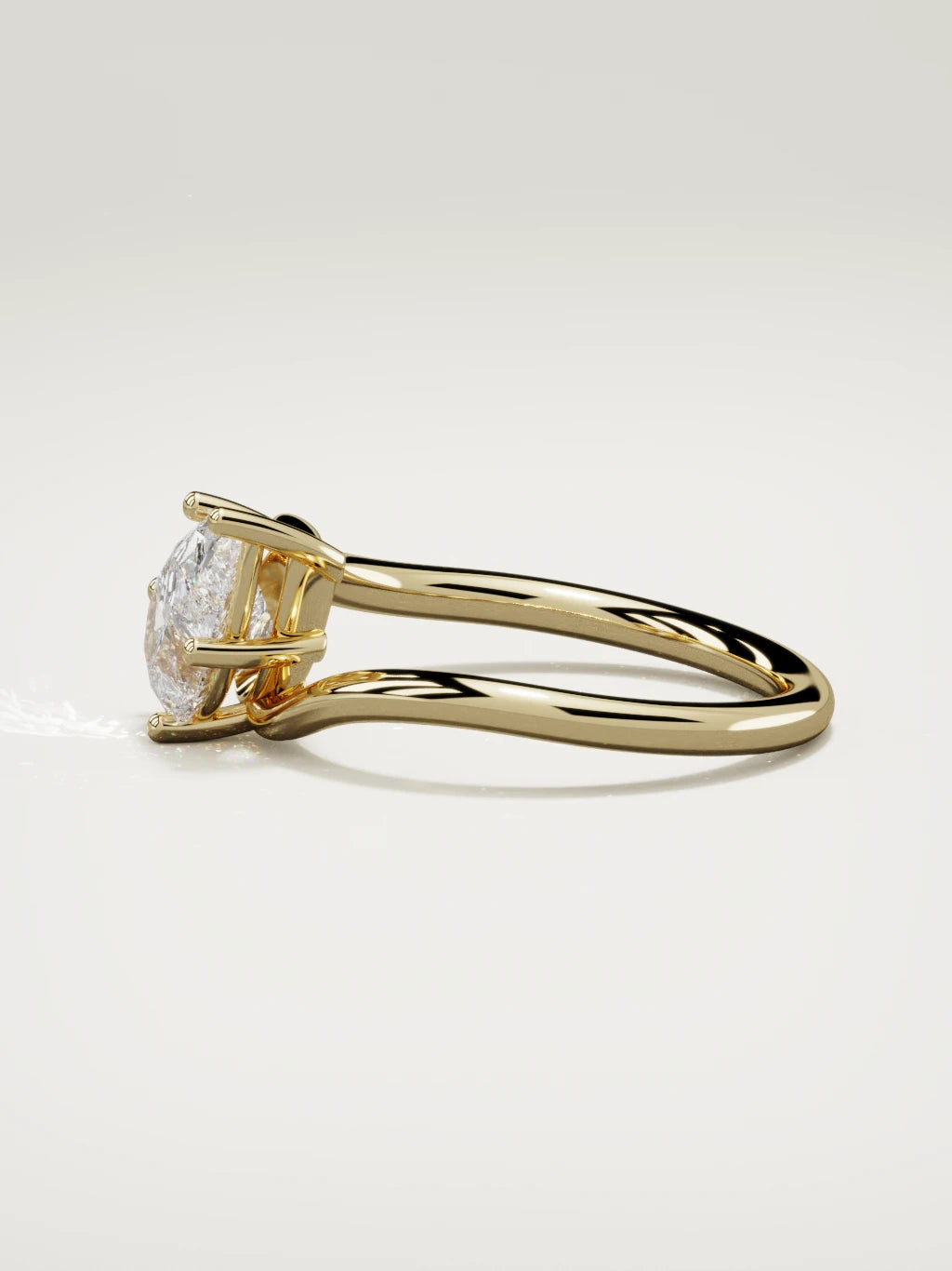 The Ola east-west pear-shaped lab-grown diamond solitaire in 14K yellow gold, side view