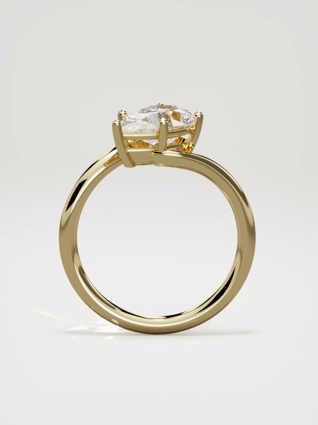 The Ola east-west pear-shaped lab-grown diamond solitaire in 14K yellow gold, standing front view