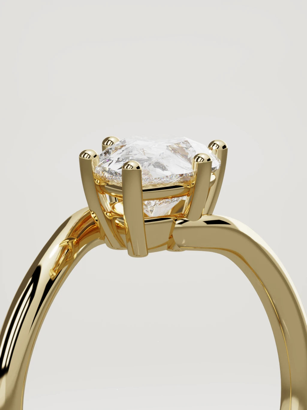 The Ola east-west pear-shaped lab-grown diamond solitaire in 14K yellow gold, standing three-quarter view