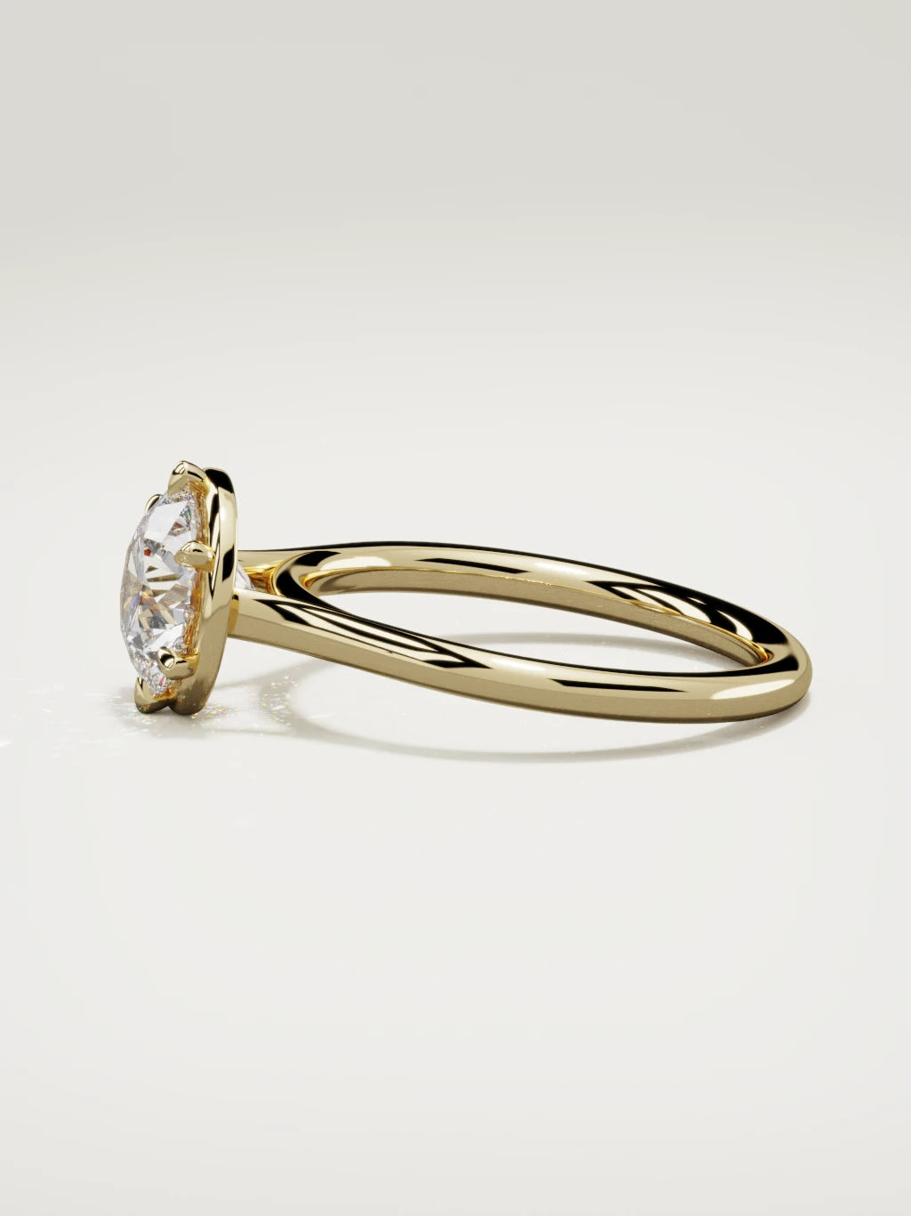 The Orbe round lab-grown diamond solitaire in 14K yellow gold, side view