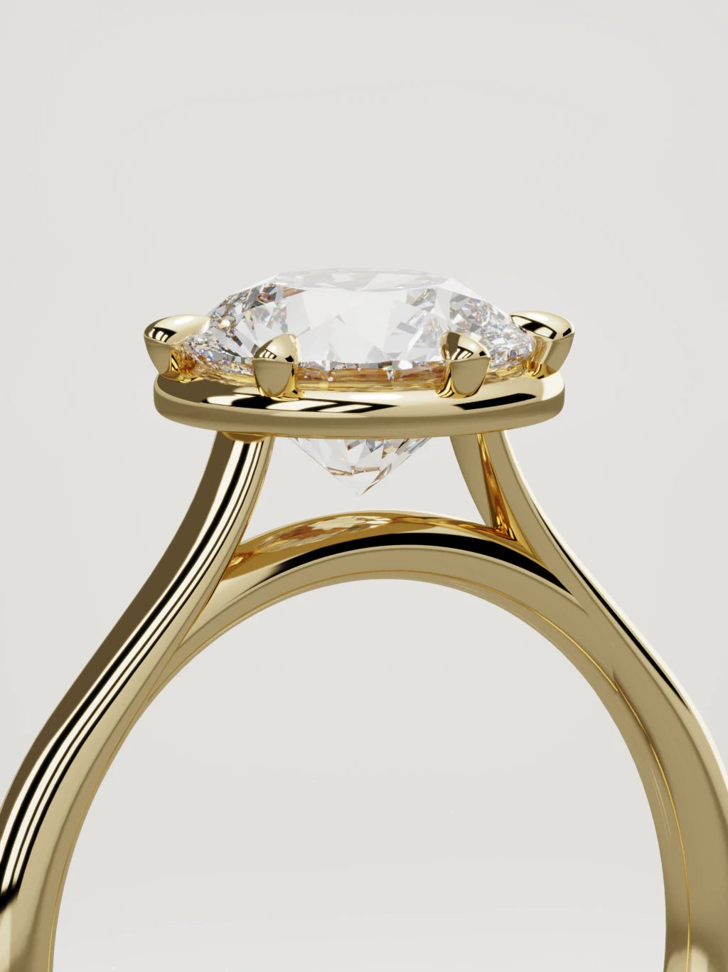 The Orbe round lab-grown diamond solitaire in 14K yellow gold, standing three-quarter view