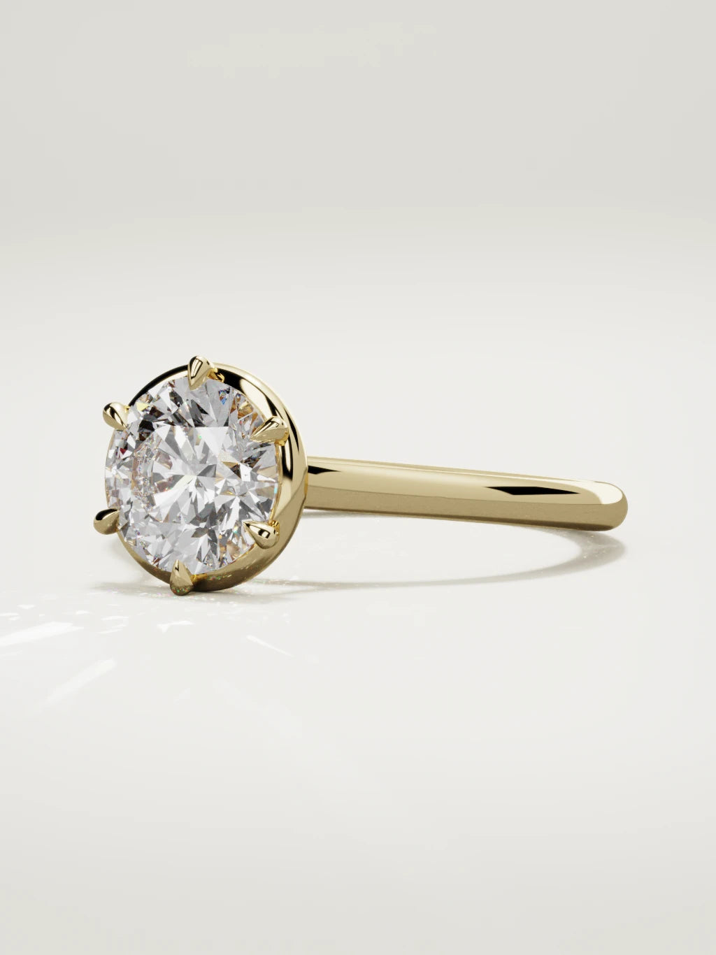 The Orbe round lab-grown diamond solitaire in 14K yellow gold, three-quarter view